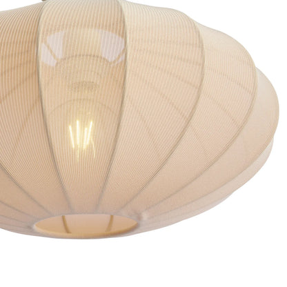 Japandi booglamp Bida beige in woonkamer boven bank